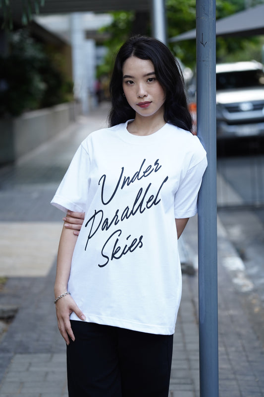 Under Parallel Skies White Logo Tee