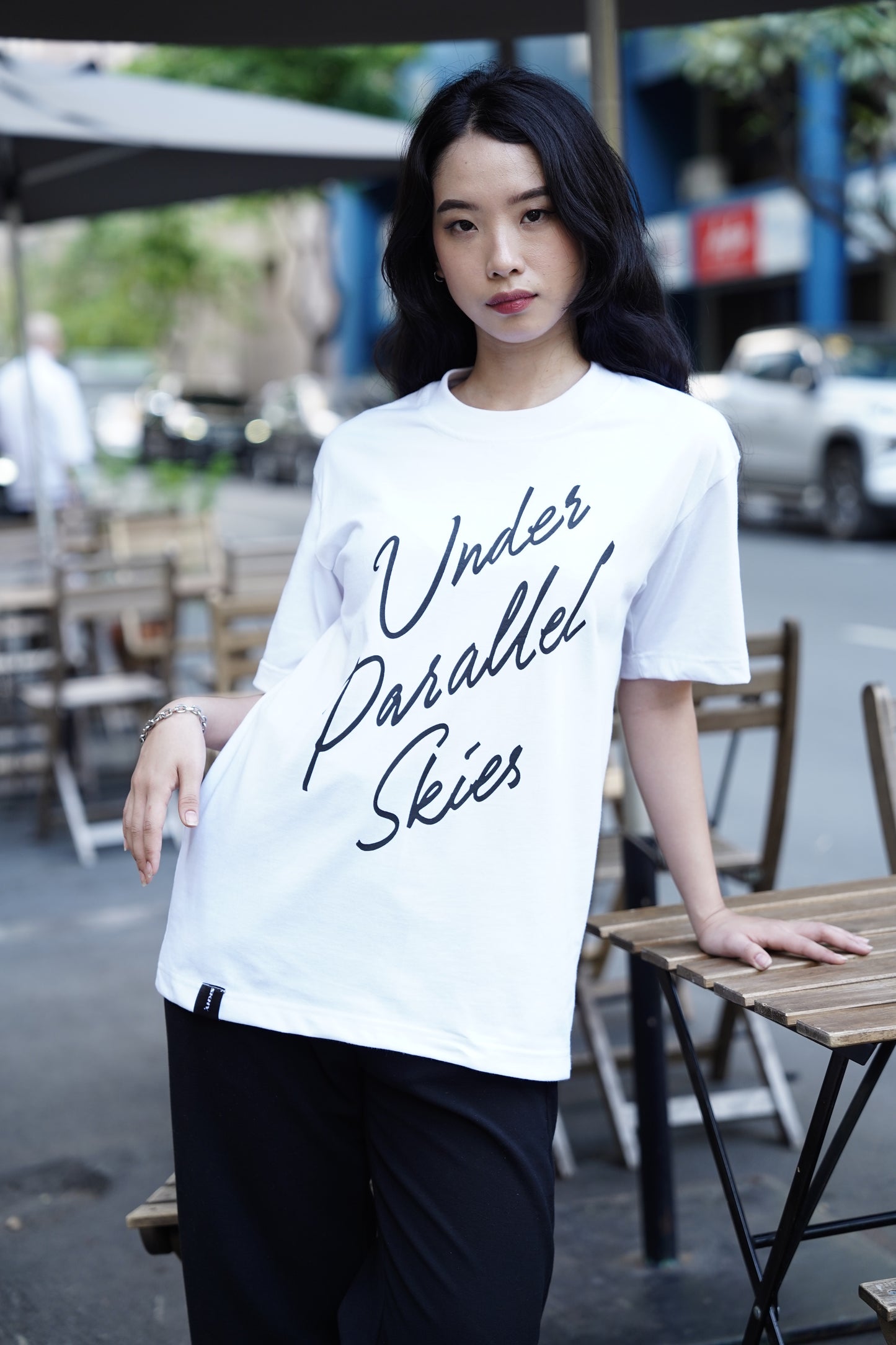 Under Parallel Skies White Logo Tee